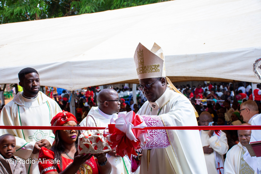 Archbishop George Desmond Tambala cuts a ribbon at Maria Mthandizi wa Akhristu Parish