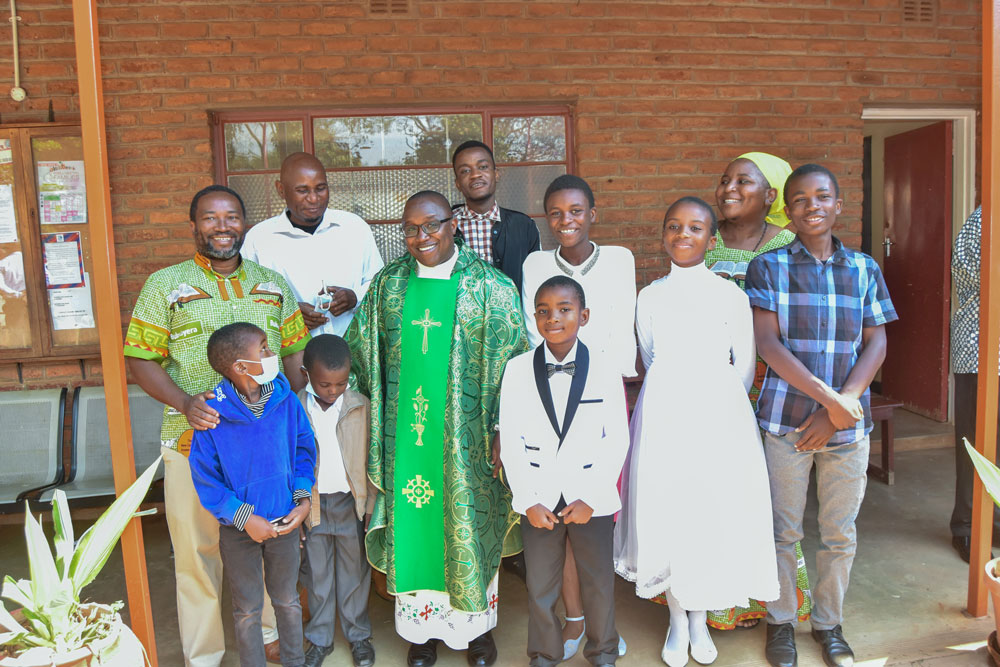 With a family soon after First Holy Communion at St Kizito Parish