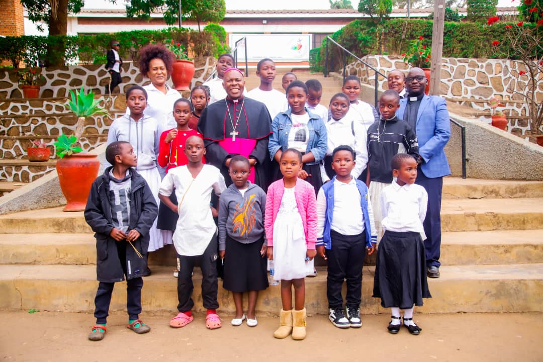 Tilitonse children with Bishop Vincent Mwakhwawa