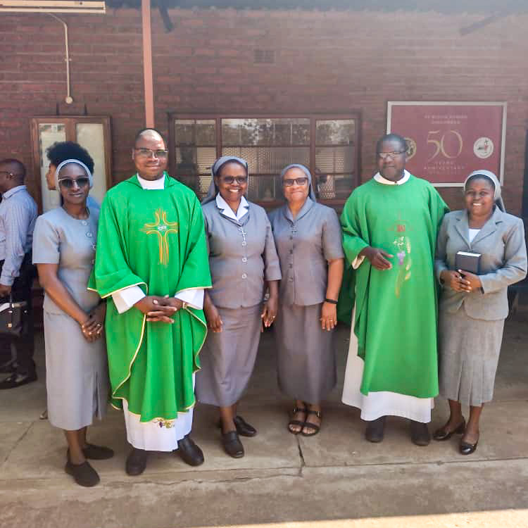 Fr ELiah Laimon and Fr John Mangwere with Medical Missionaries of Mary Sisters