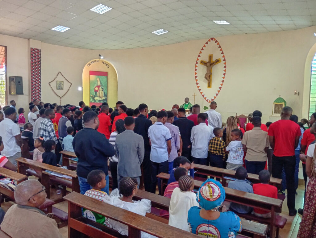 St Kizito Parish Youth being blessed by Fr John Mangwere