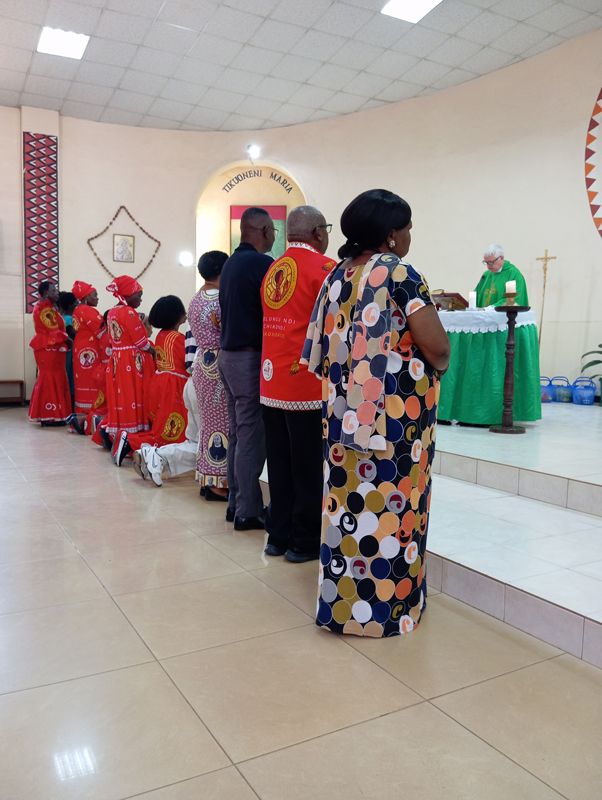St Vincent de Paul receiving blessings during mass at St Kizito Parish