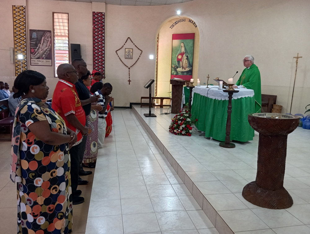 St Vincent de Paul receiving blessings during mass at St Kizito Parish