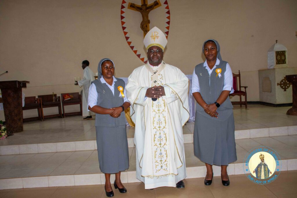 sr stellia sosola and sr flora phwandaphwanda with archbishop george desmond tambala