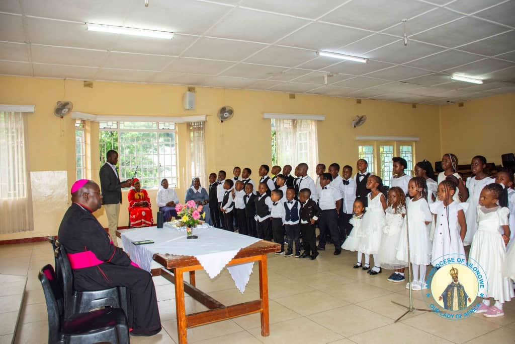 st kizito parish children sing christmas carols for archbishop george desmond tambala