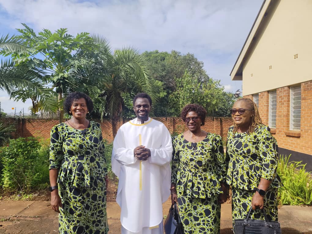 Mrs Sophie Asimenye Kalinde, Mrs Lilian Ghambi, and Mrs Bernadetta Kwacha Kulemeka with Fr August Ashie