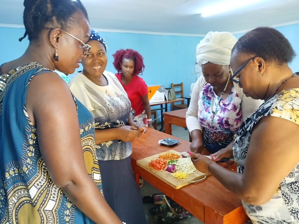 sisters of the holy rosary with women from st kizito parish cooking class