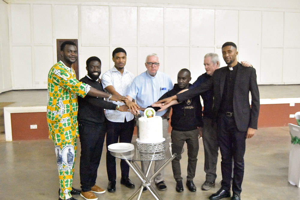 priests cut the st patrick's day cake