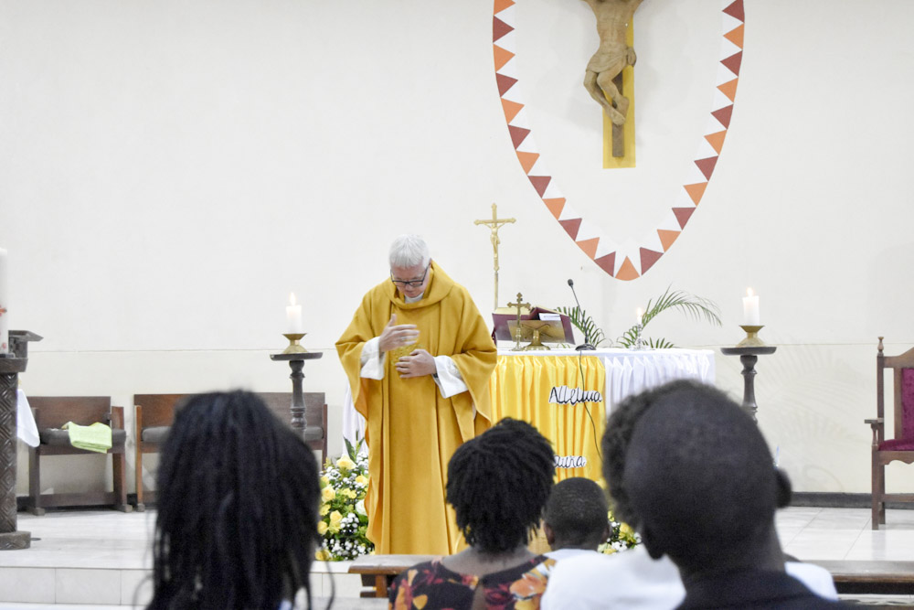 fr martin mulholland being blessed by the congregation