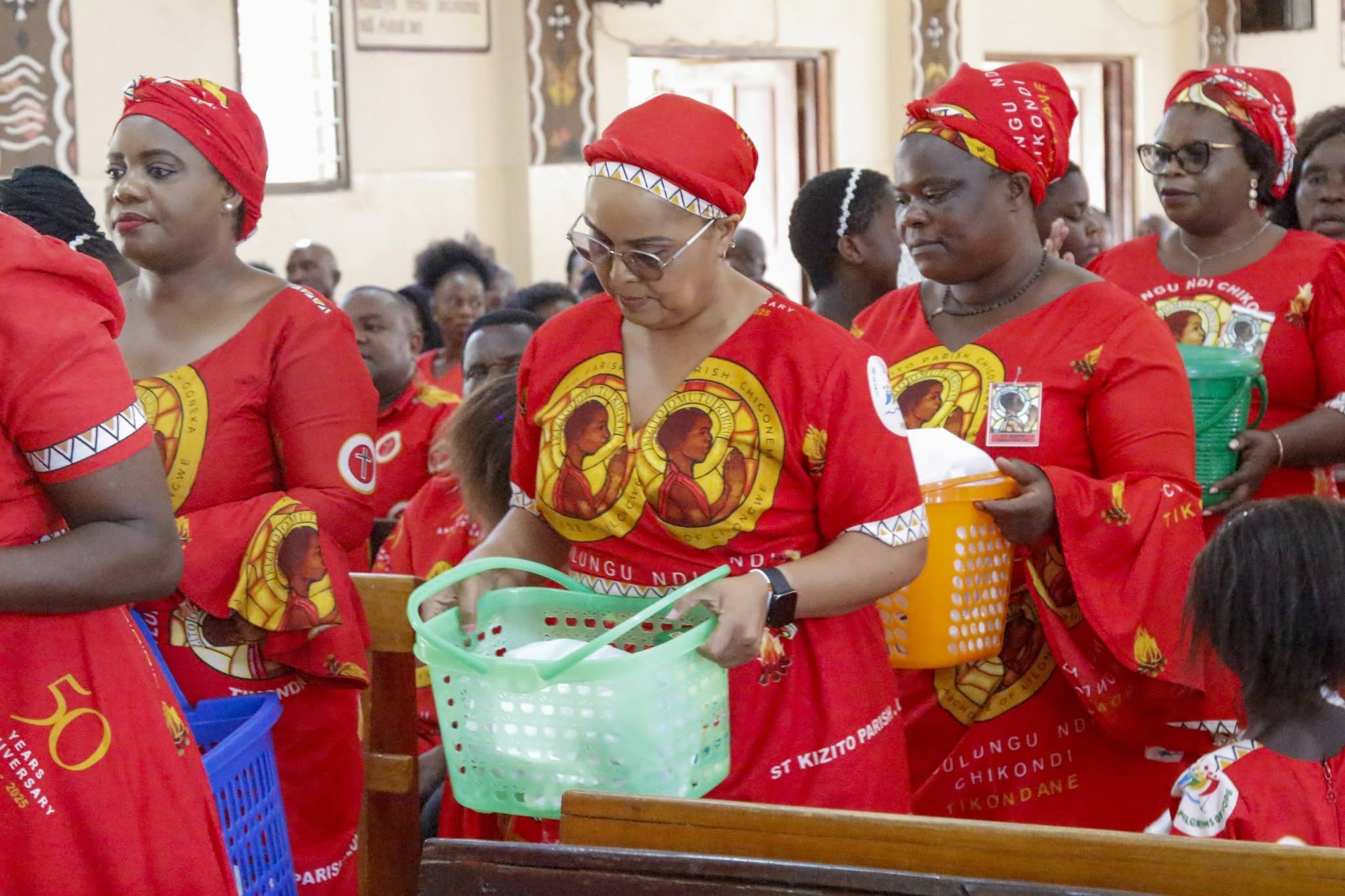 St Kizito parishioners present their gifts